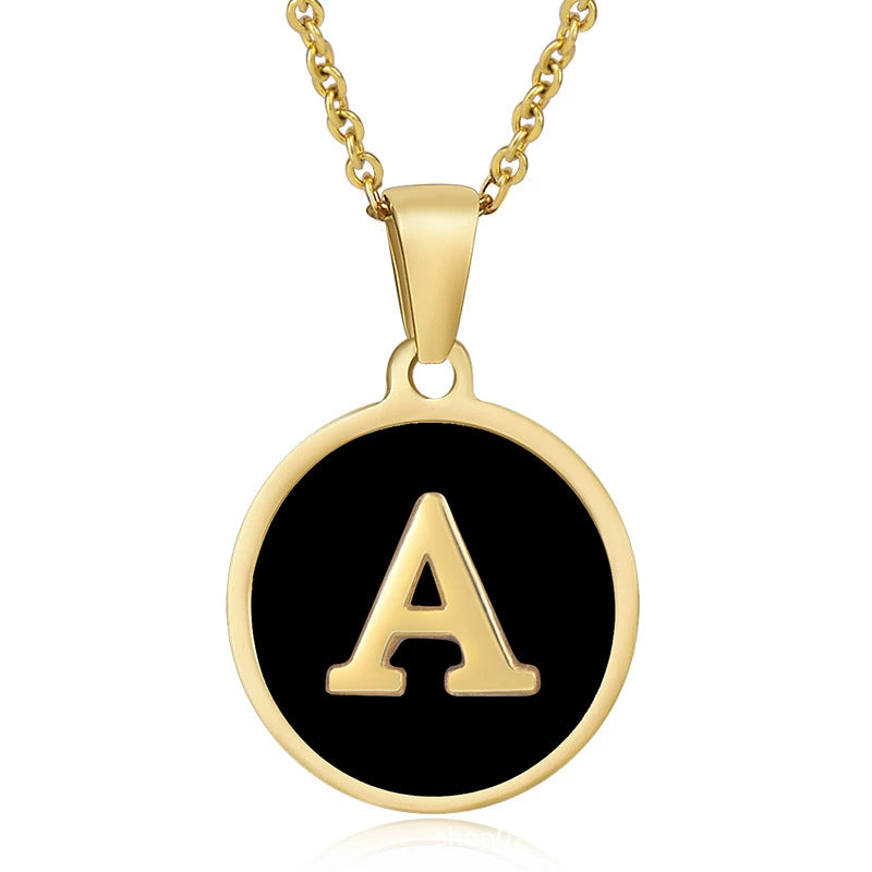 Gold initial disc necklace with letter A on a round black pendant