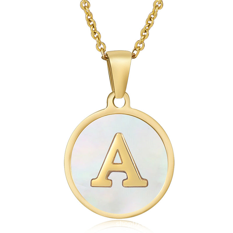 Gold initial disc necklace with letter A on a round mother of pearl pendant