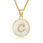 Perrine gold initial disc necklace, letter C on mother of pearl