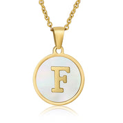 Perrine gold initial disc necklace, letter F on mother of pearl