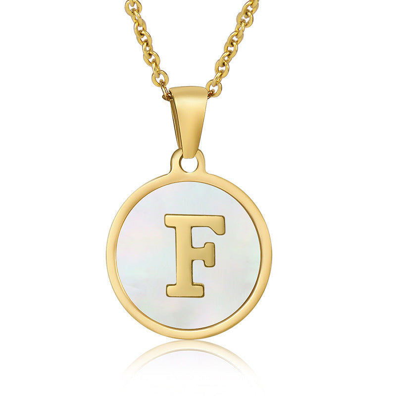 Perrine gold initial disc necklace, letter F on mother of pearl