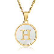 Perrine gold initial disc necklace, letter H on mother of pearl