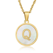 Perrine gold initial disc necklace, letter Q on mother of pearl