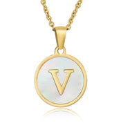 Perrine gold initial disc necklace, letter V on mother of pearl