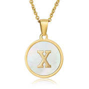 Perrine gold initial disc necklace, letter X on mother of pearl