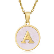 Gold initial disc necklace with letter A on a round pink mother of pearl pendant