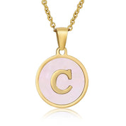 Perrine pink initial disc necklace, letter C on pink mother of pearl