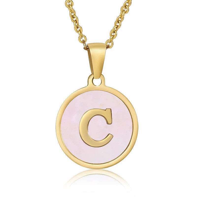 Perrine pink initial disc necklace, letter C on pink mother of pearl