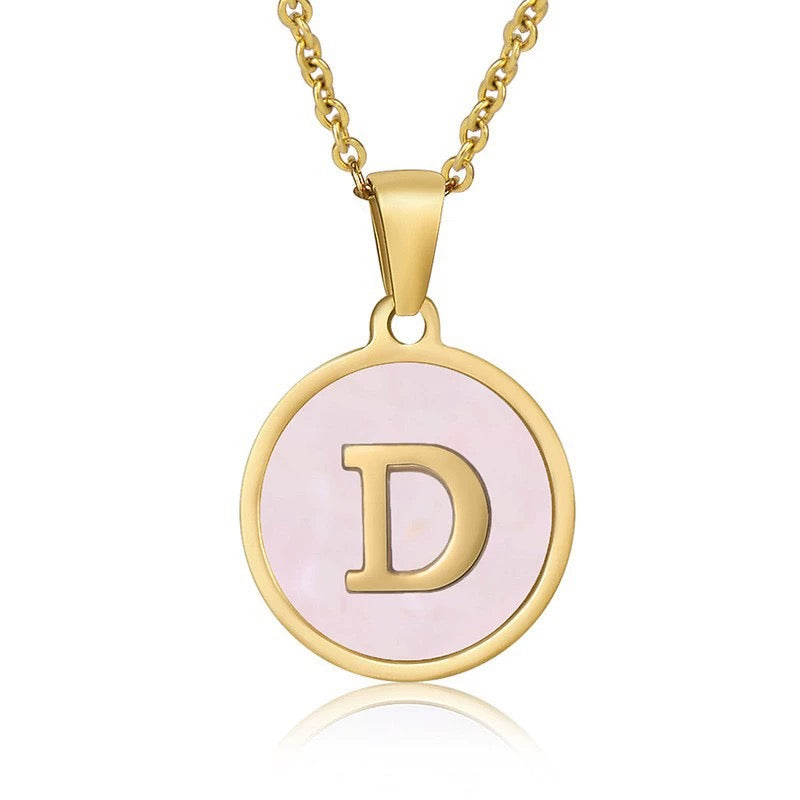 Perrine pink initial disc necklace, letter D on pink mother of pearl