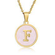Perrine pink initial disc necklace, letter F on pink mother of pearl