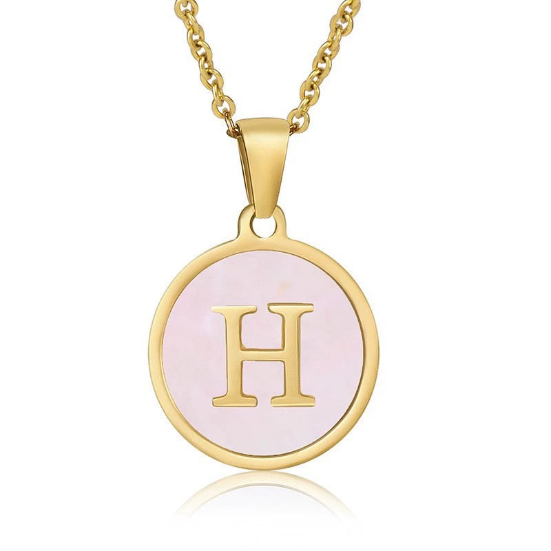 Perrine pink initial disc necklace, letter H on pink mother of pearl