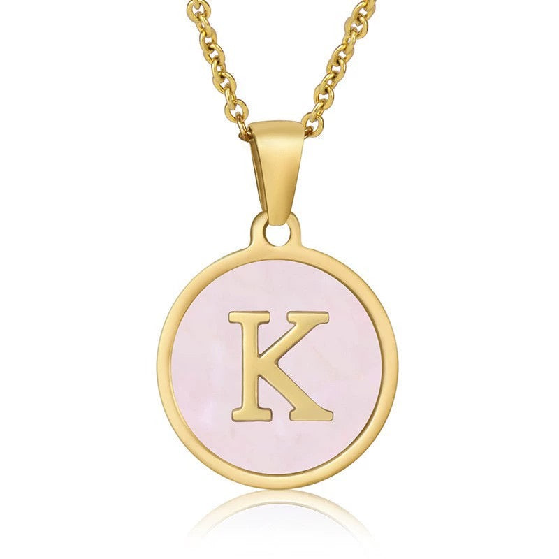 Perrine pink initial disc necklace, letter K on pink mother of pearl