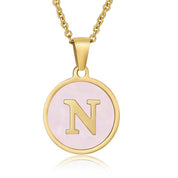 Perrine pink initial disc necklace, letter N on pink mother of pearl
