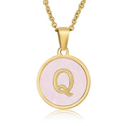 Perrine pink initial disc necklace, letter Q on pink mother of pearl