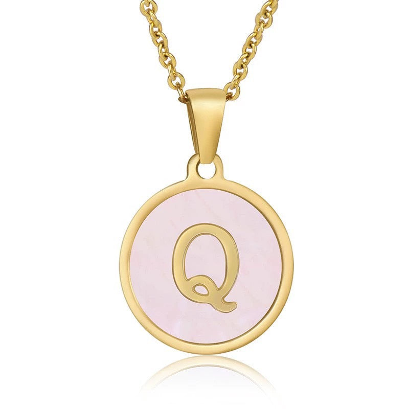 Perrine pink initial disc necklace, letter Q on pink mother of pearl