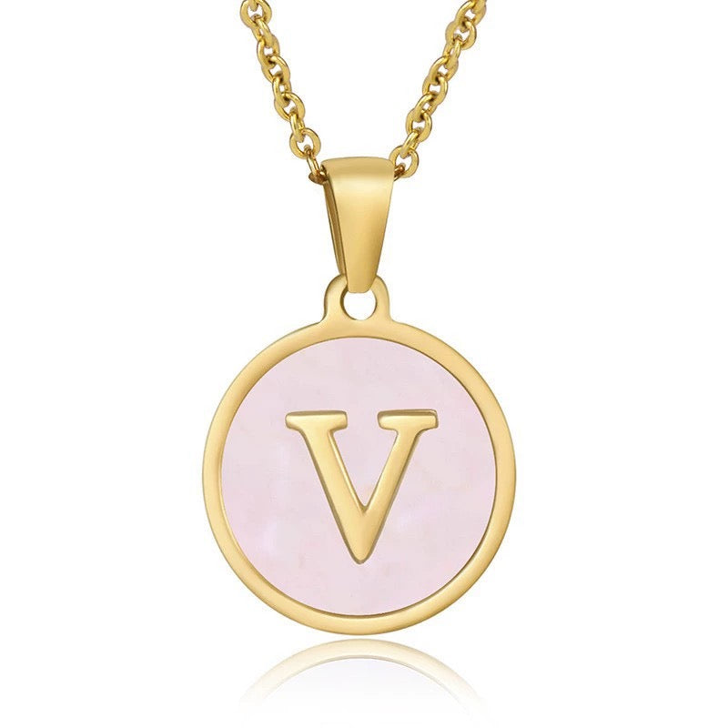 Perrine pink initial disc necklace, letter V on pink mother of pearl