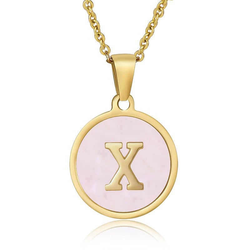 Perrine pink initial disc necklace, letter X on pink mother of pearl