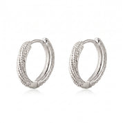 Silver rope huggie earrings as a pair on white