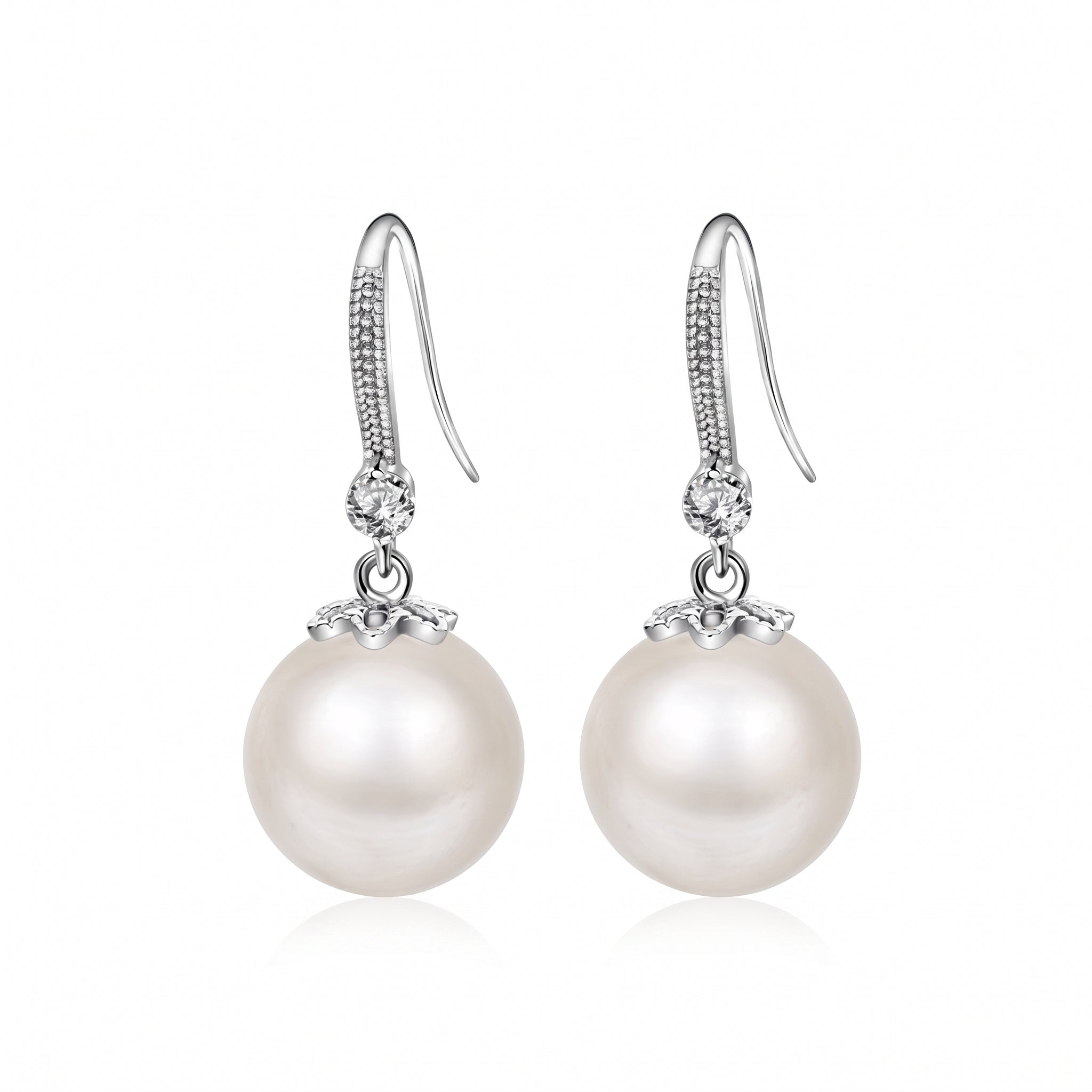 Pair of Sabine silver pearl drop earrings with crystal hooks on white background
