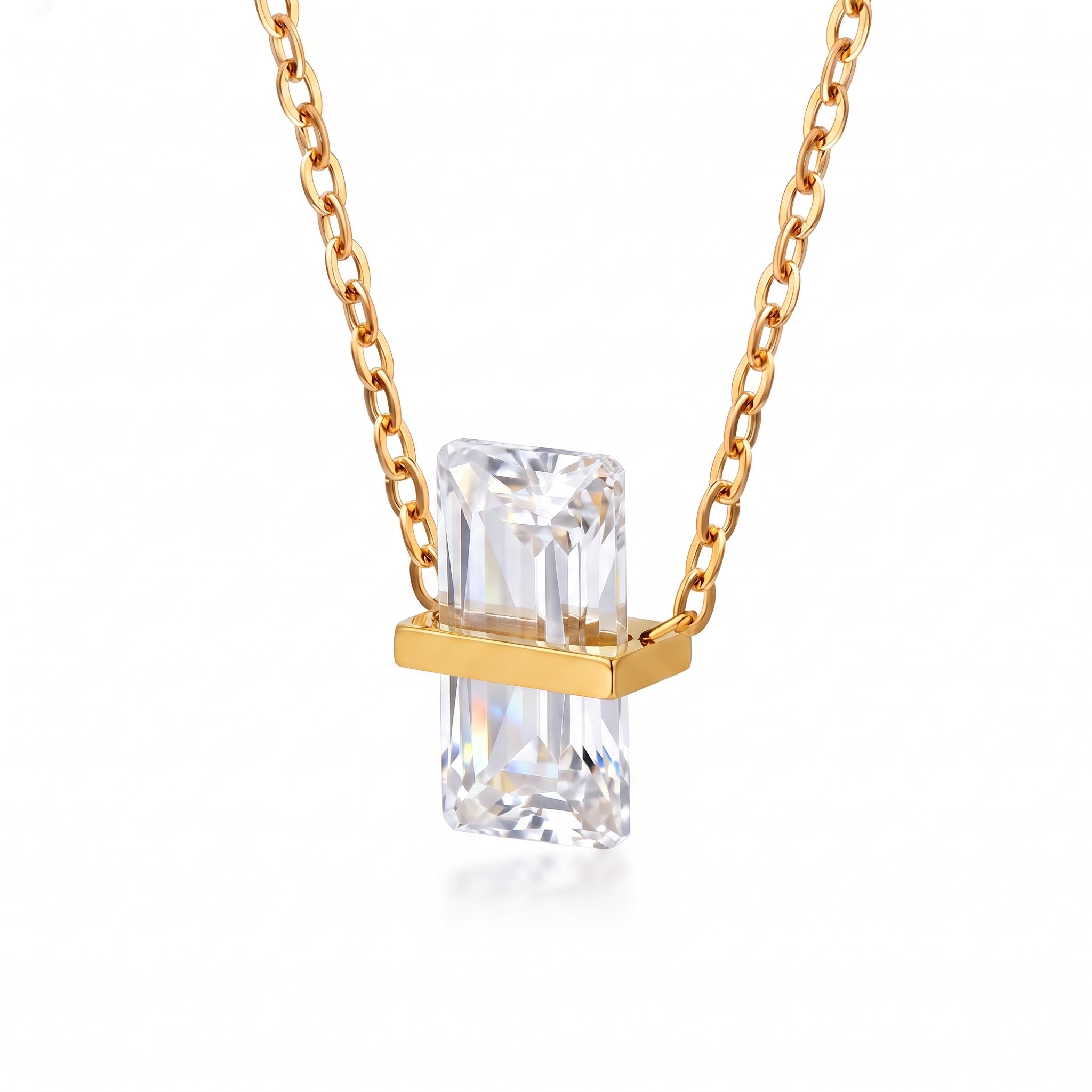 Gold birthstone necklace with a clear rectangular crystal