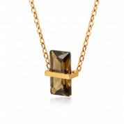 Gold birthstone necklace with an olive brown rectangular crystal