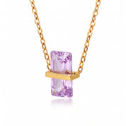 Gold birthstone necklace with a lavender rectangular crystal