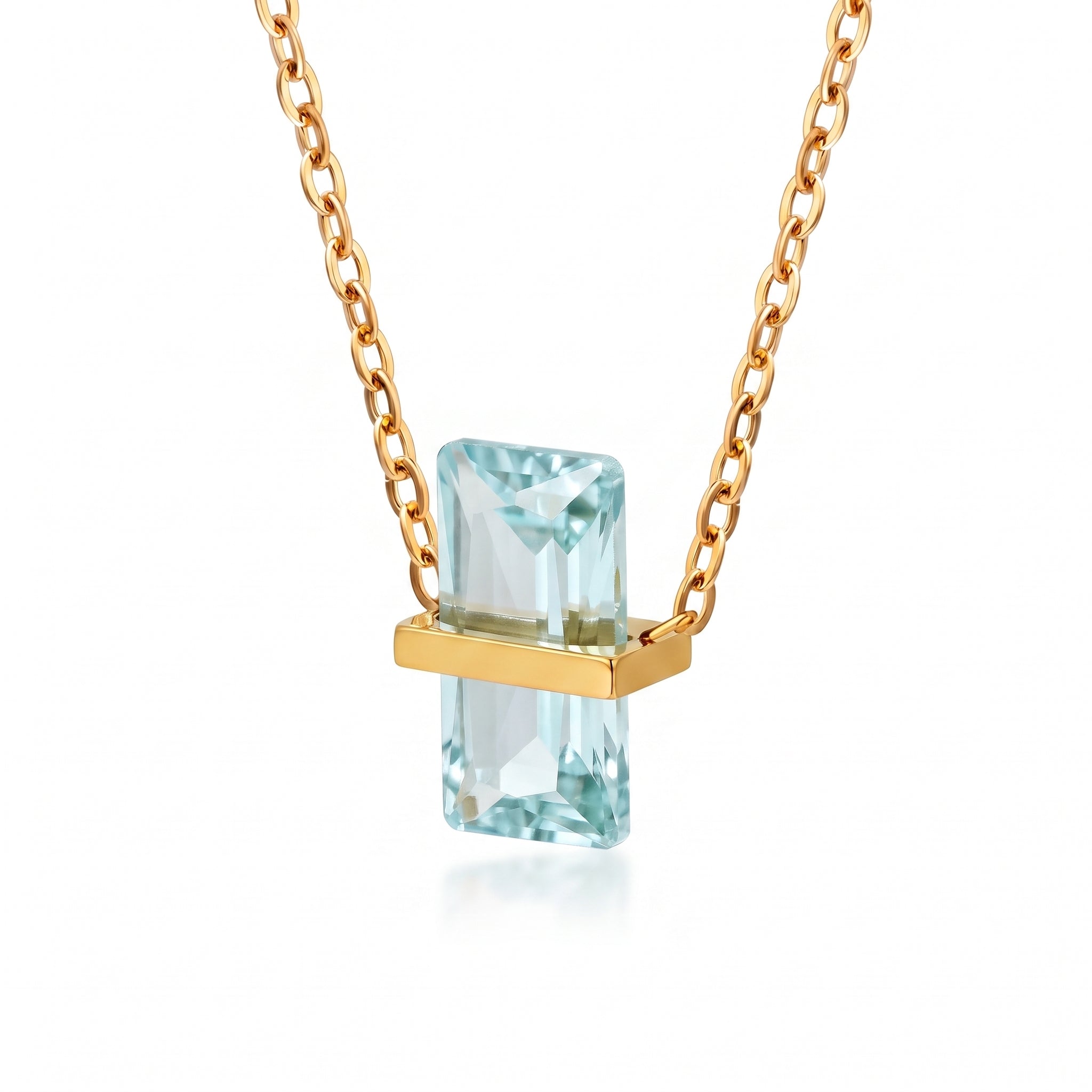 Gold birthstone necklace with a pale aqua rectangular crystal
