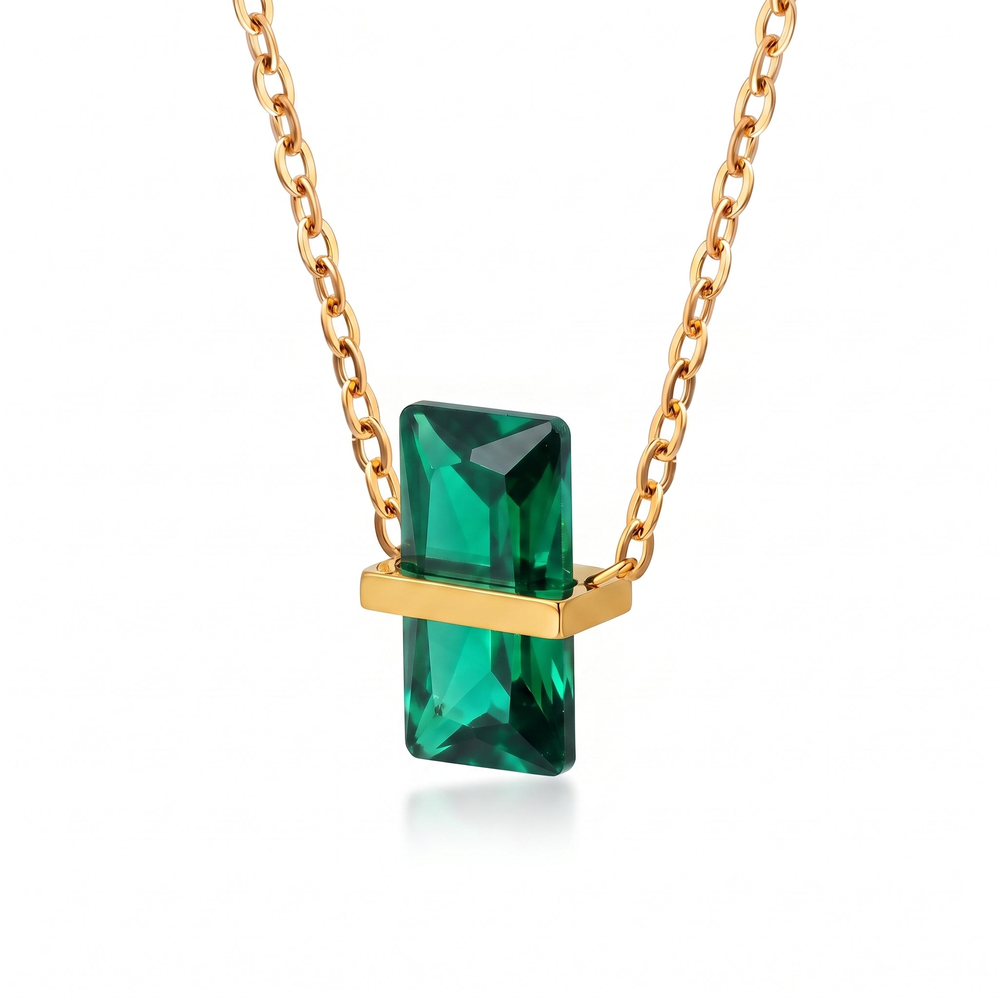 Gold birthstone necklace with a green rectangular crystal