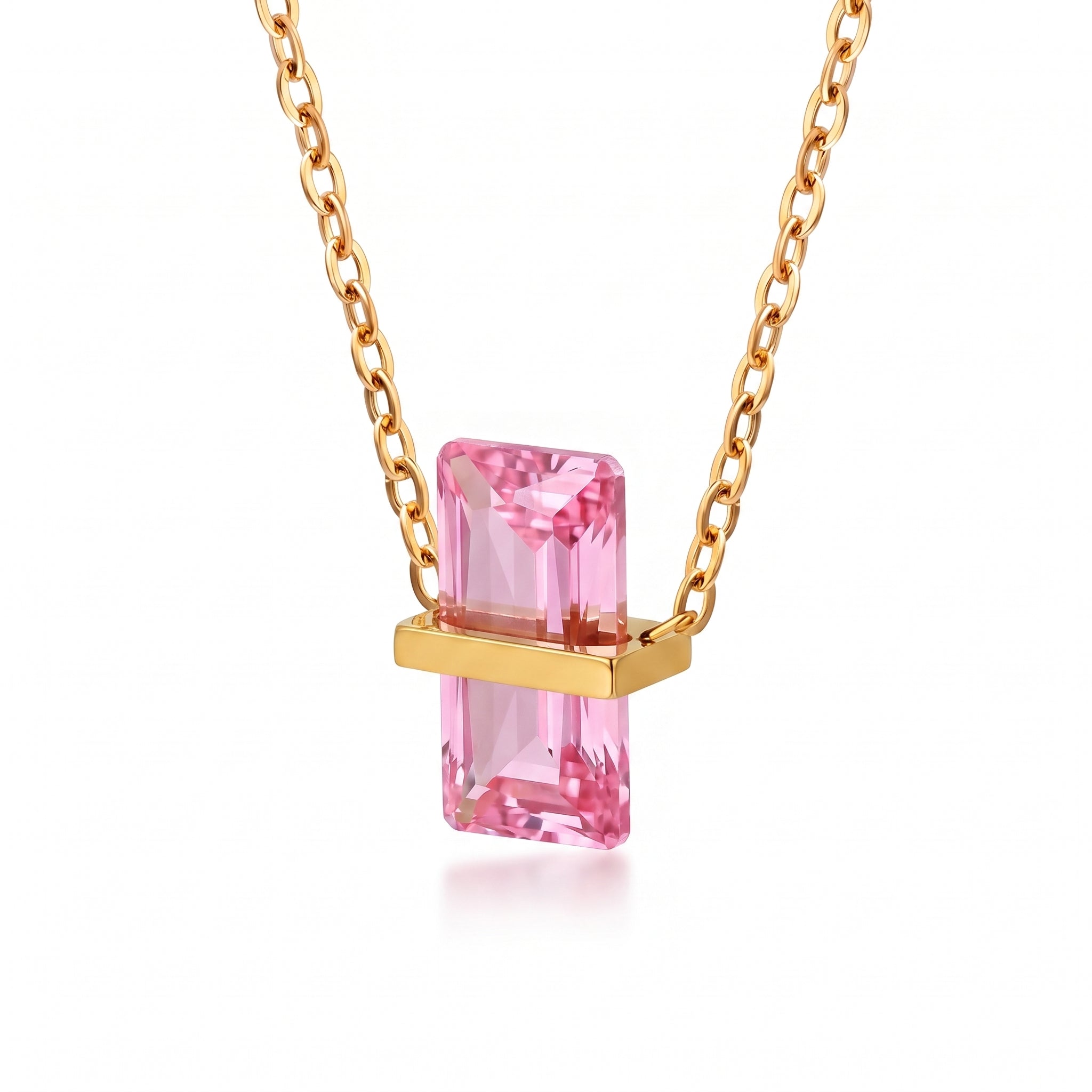Gold birthstone necklace with a pink rectangular crystal