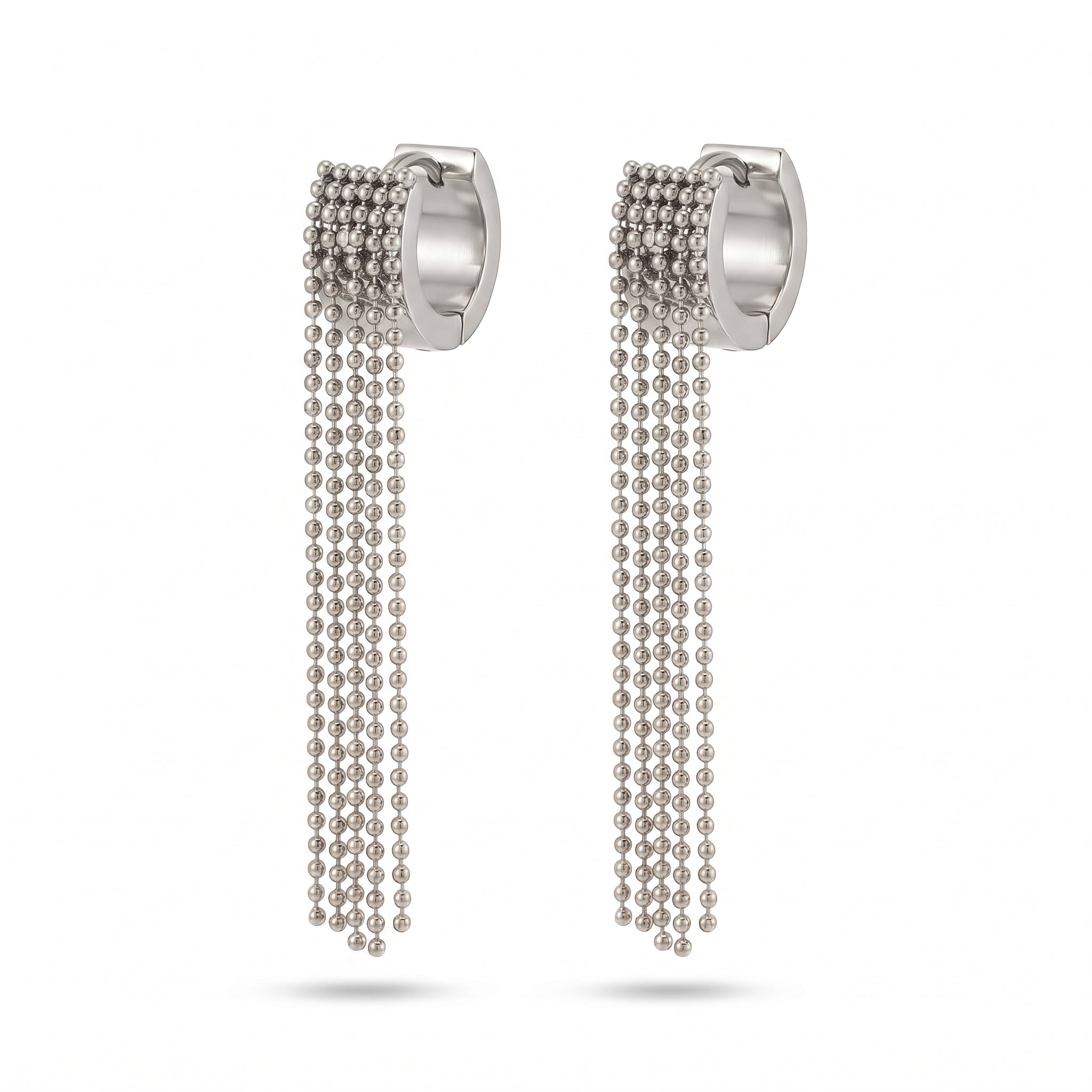 Pair of silver ball chain tassel earrings on white
