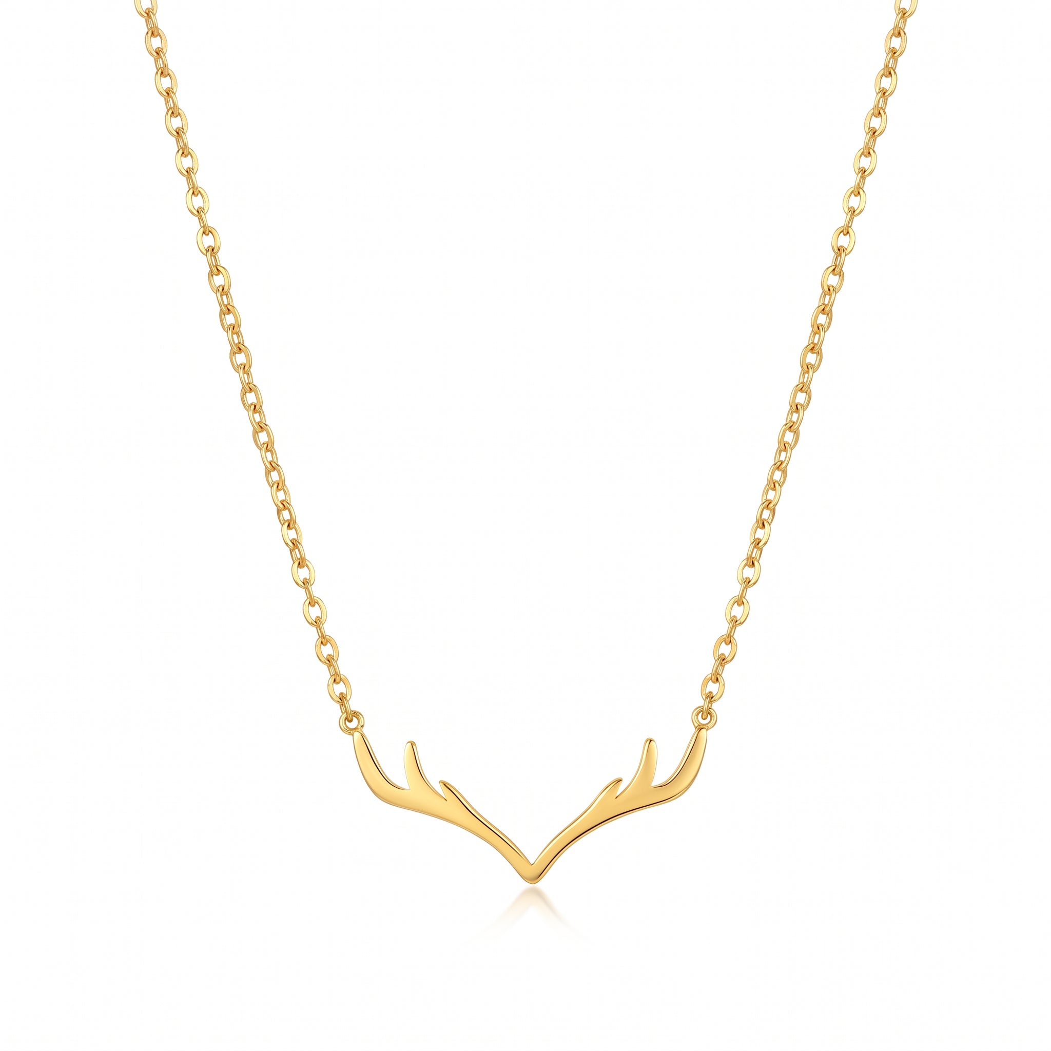 Gold antler necklace with cable chain, laid on white