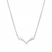 Silver antler necklace with cable chain, laid on white