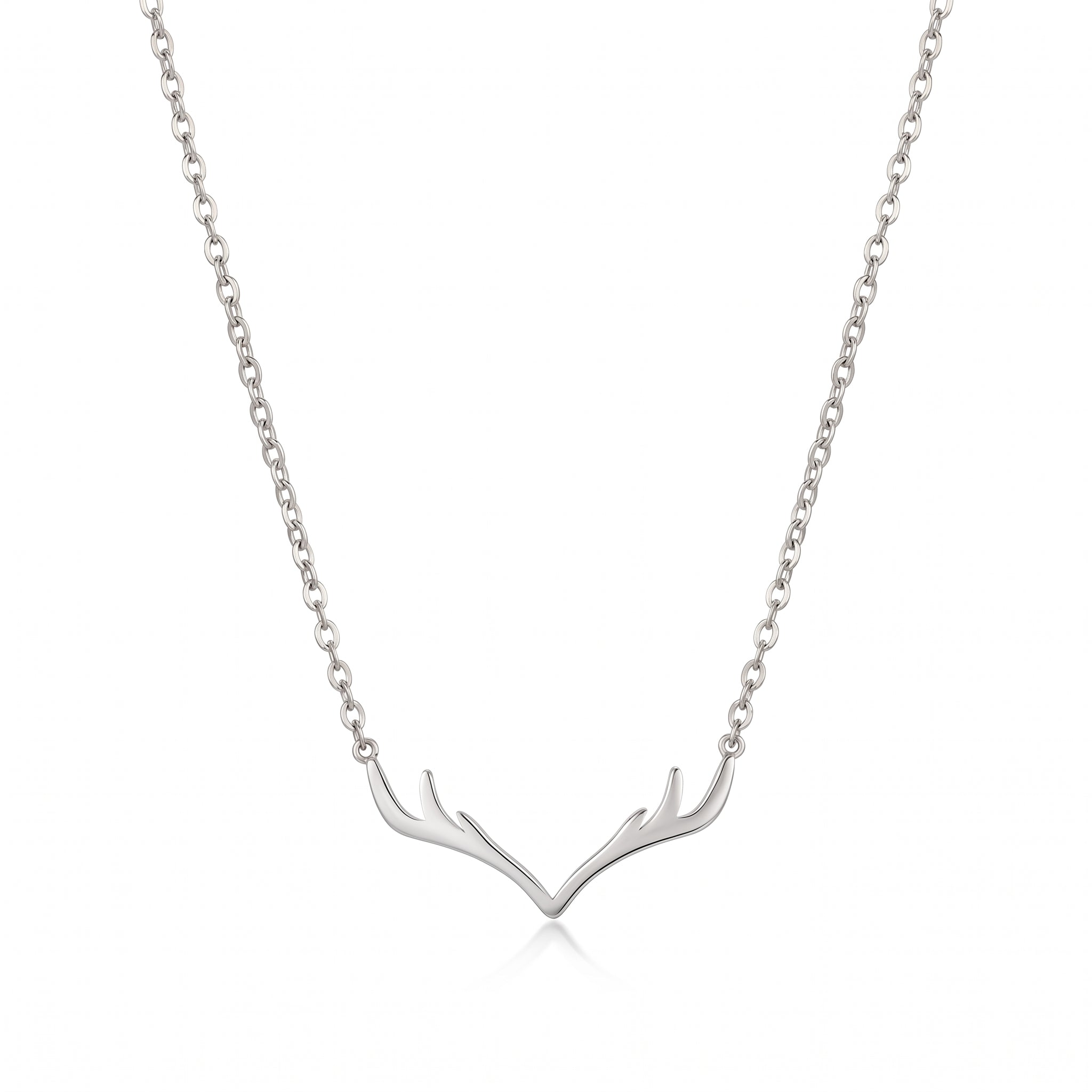Silver antler necklace with cable chain, laid on white