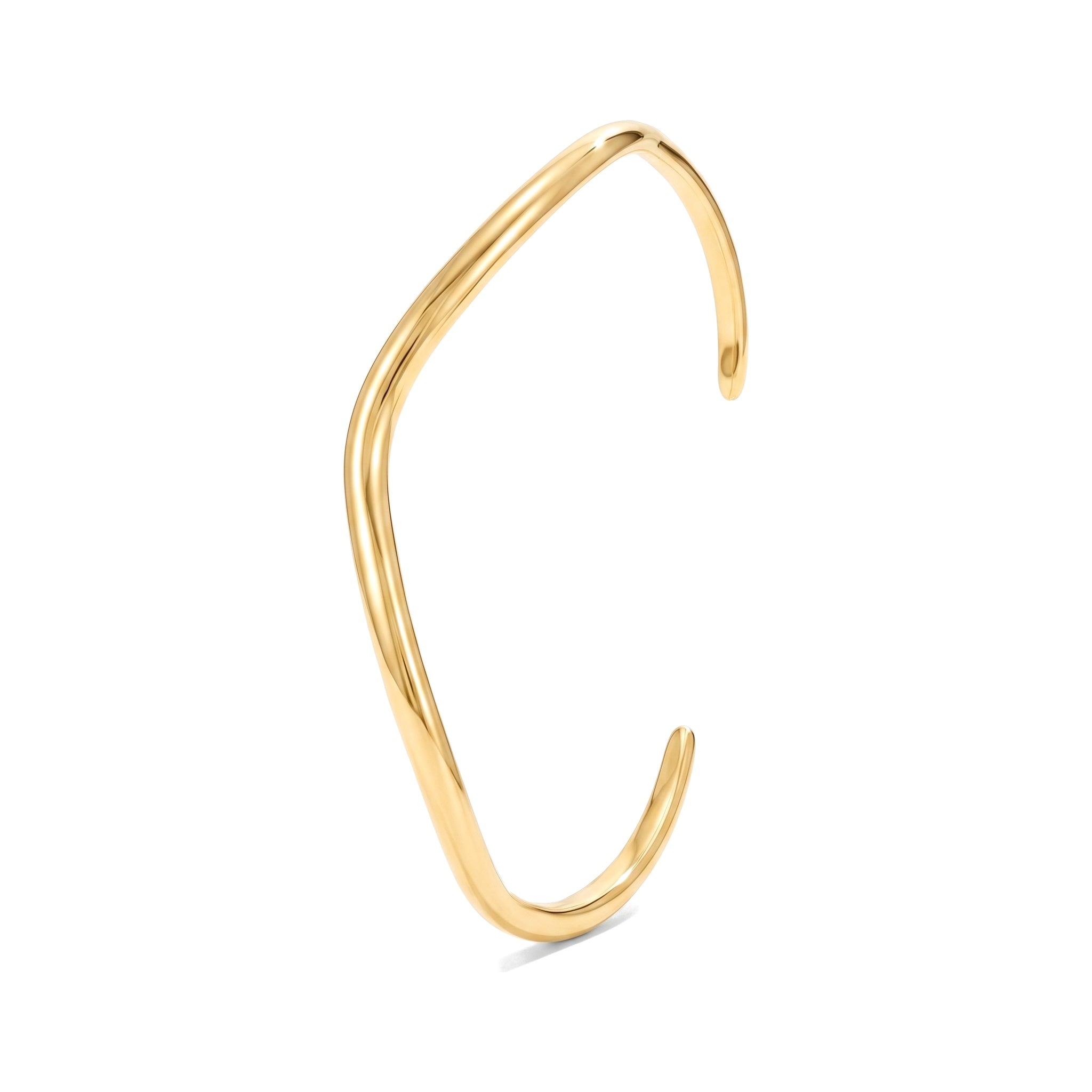 Gold open cuff bracelet with a gentle curve on a white background