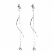 Pair of silver wave drop earrings with crystals on white