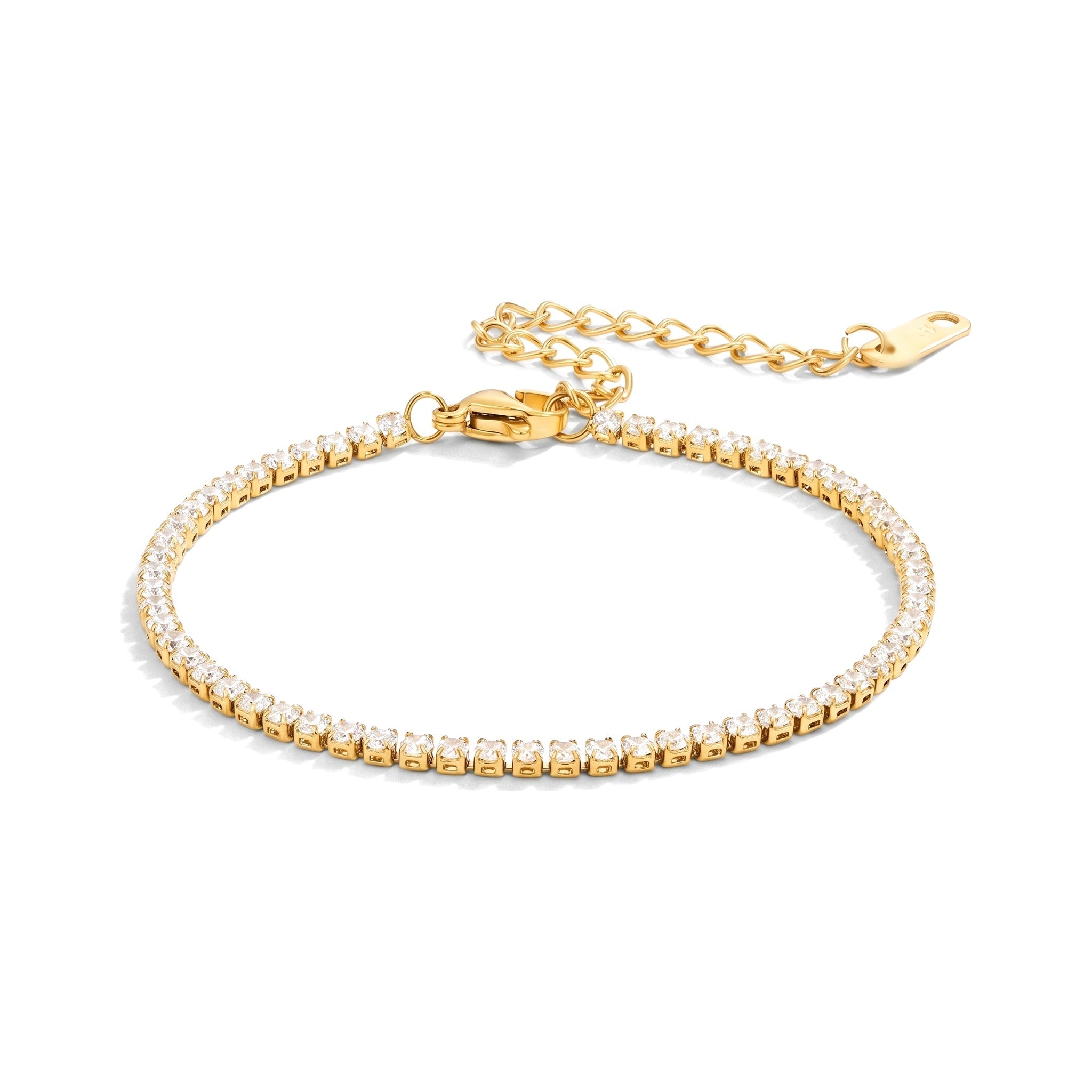 Gold tennis bracelet with small clear crystals on a white background